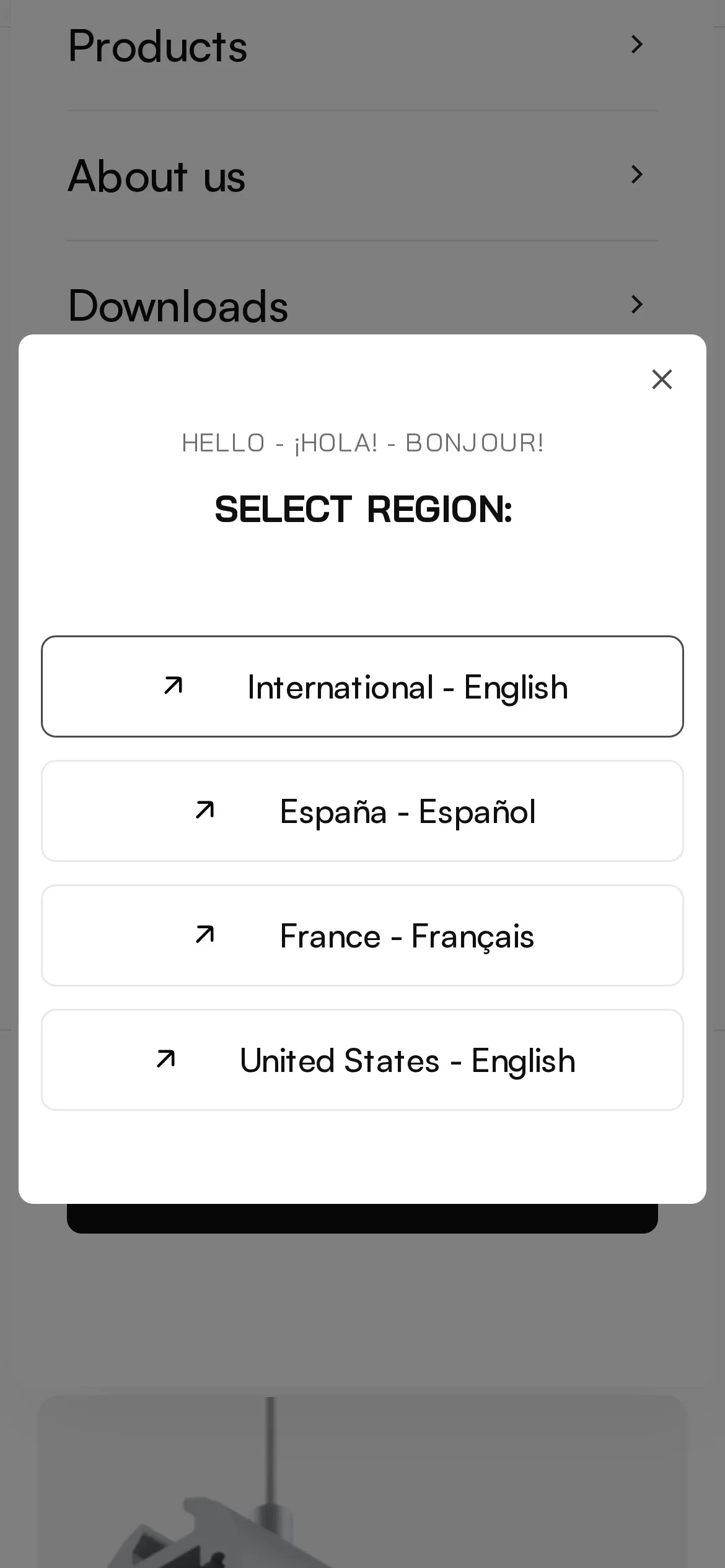 Okno „Select region” otwarte z menu na telefonie: wybór wersji International – English, España – Español, France – Français i United States – English